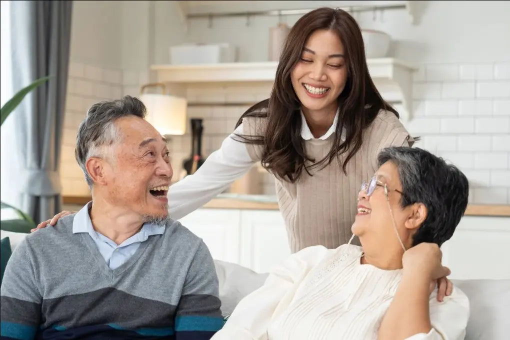 An adult daughter spending time at home with her parents.